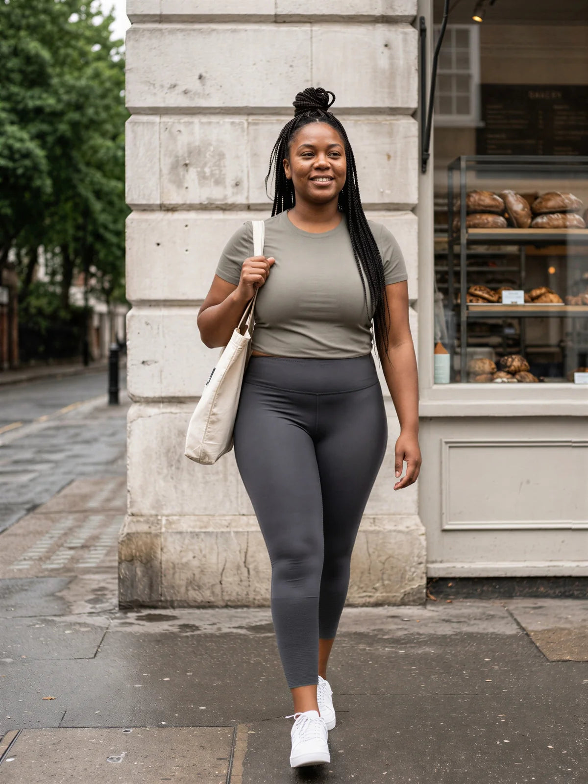 Walking past a bakery, in the grey top