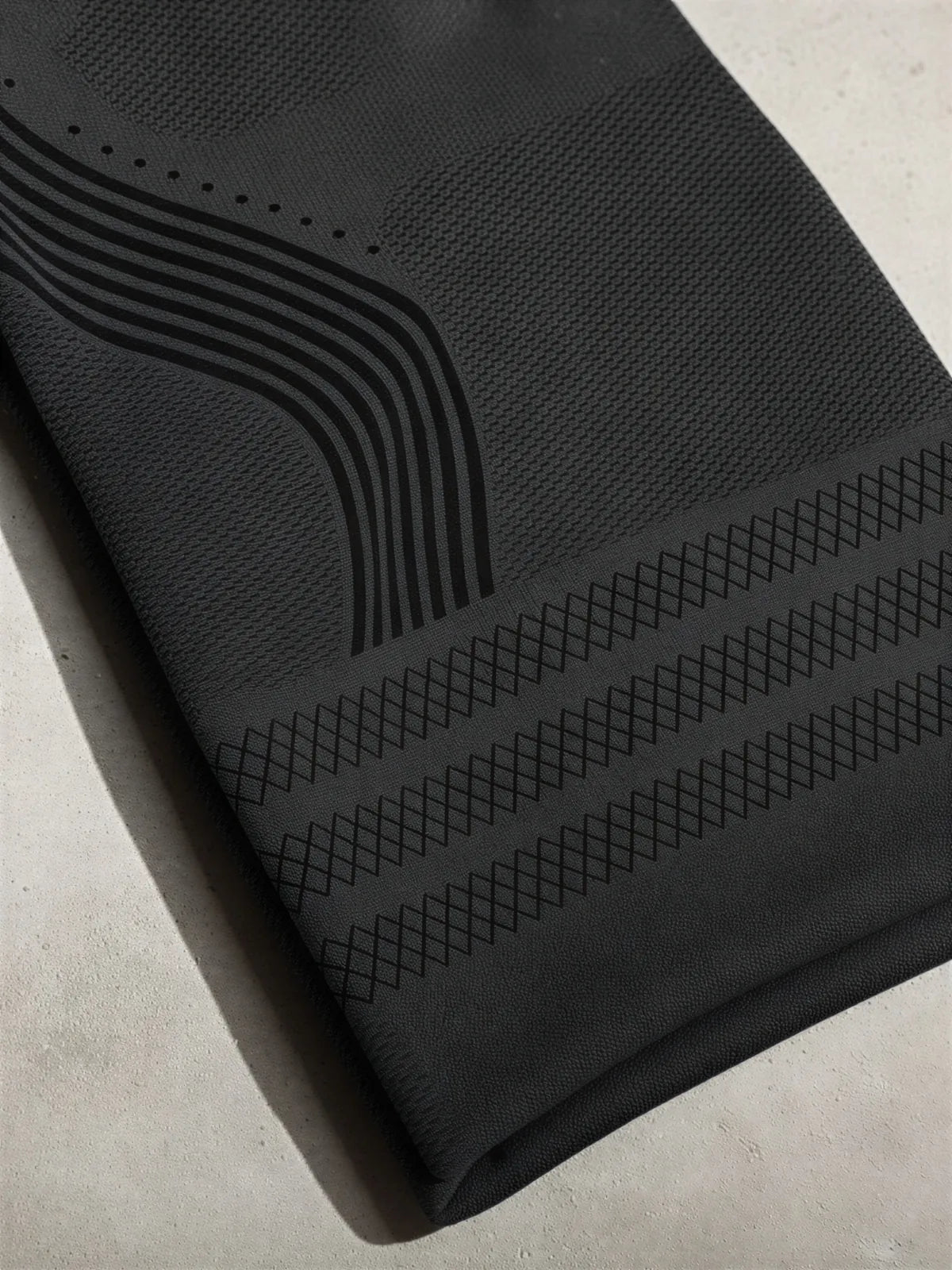 Close-up of the black textured knit