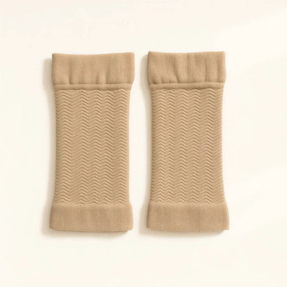 A pair of beige arm sleeves, flat